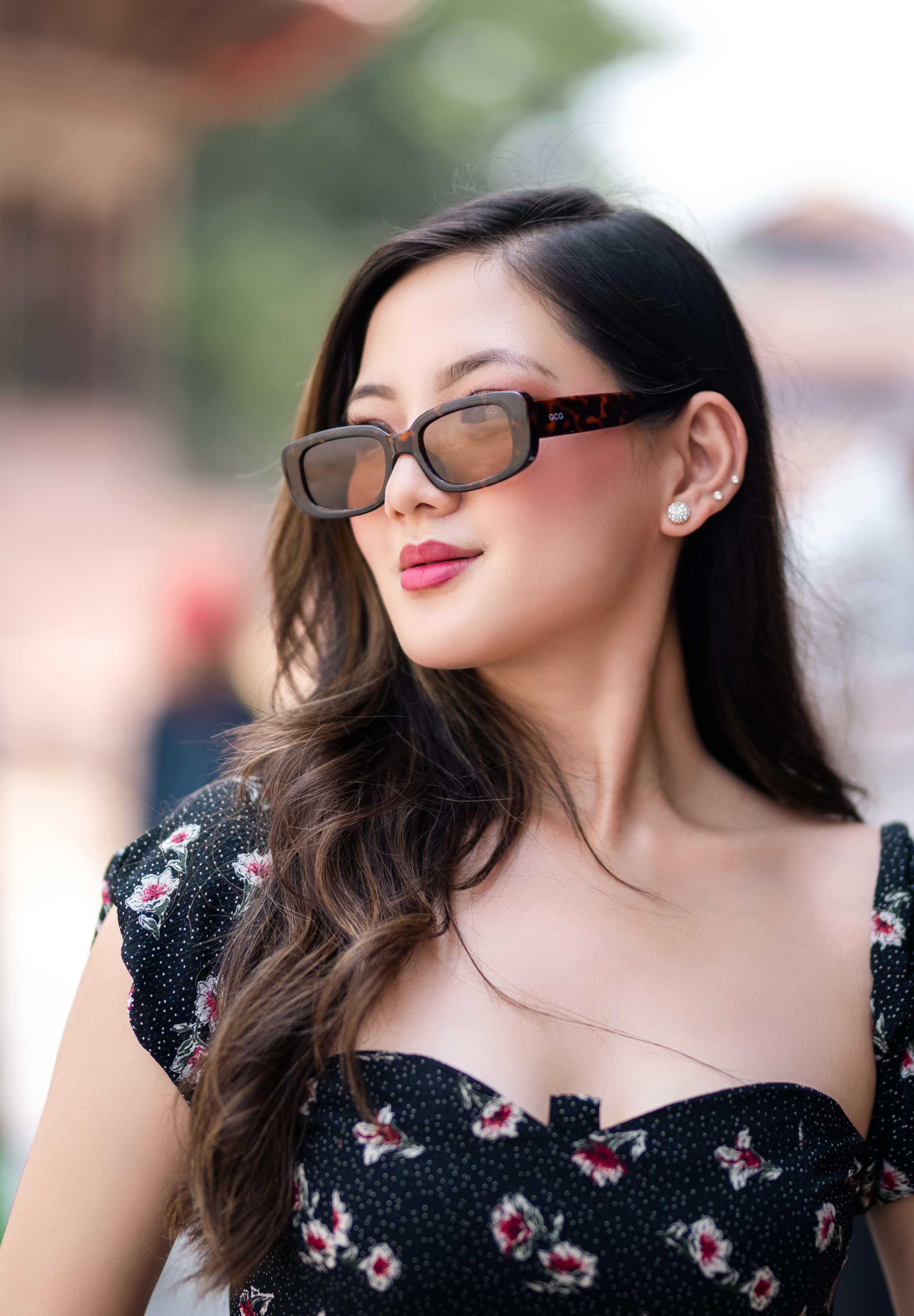 Two girls wearing one eyewear brand