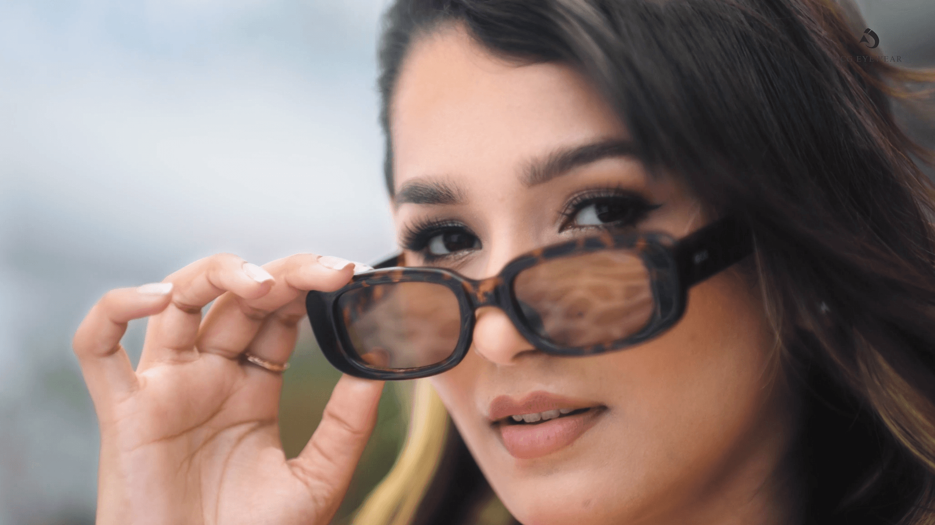 Two girls wearing one eyewear brand